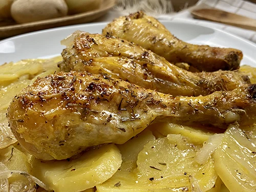 Roast chicken with potatoes and white wine