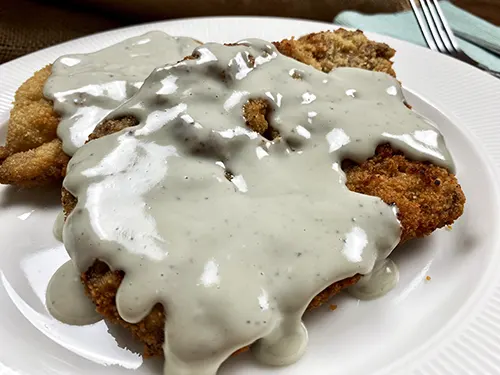 Escalopes with Cabrales cheese sauce