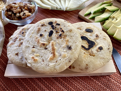 Arepa de chicharrón (pork belly cracklings arepa)